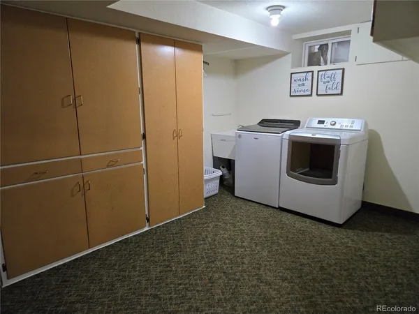 a view of a storage & utility room with washer and dryer