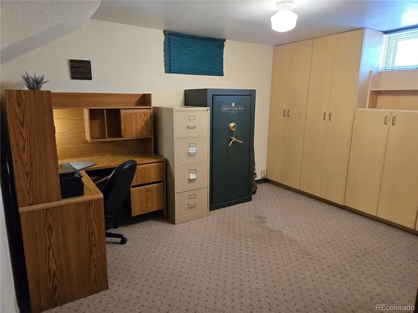 a view of a storage & utility room with two washing machine