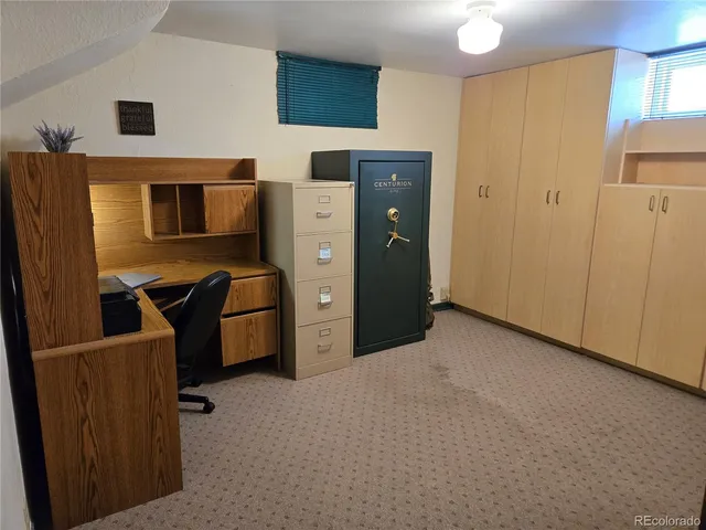 a view of a storage & utility room with two washing machine