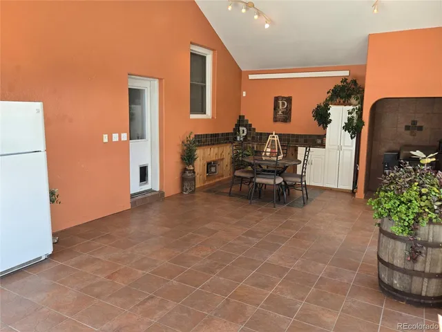 a lobby with furniture and potted plant