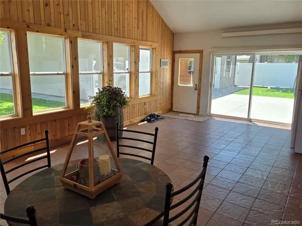 a view of a livingroom with furniture and a window
