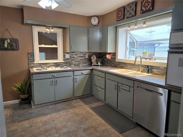 a kitchen with a sink and cabinets