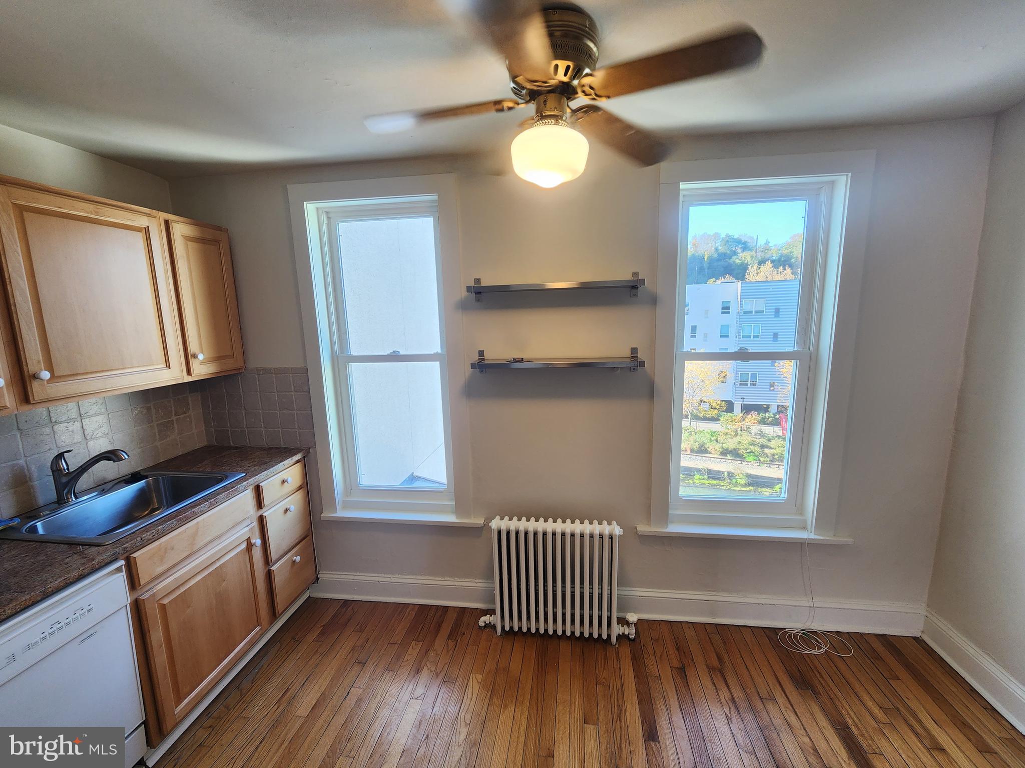 4322 Main Street, Unit 2 Philadelphia, PA 19127 - Photo 13 of 27 a view of a room with wooden floor cabinets and windows