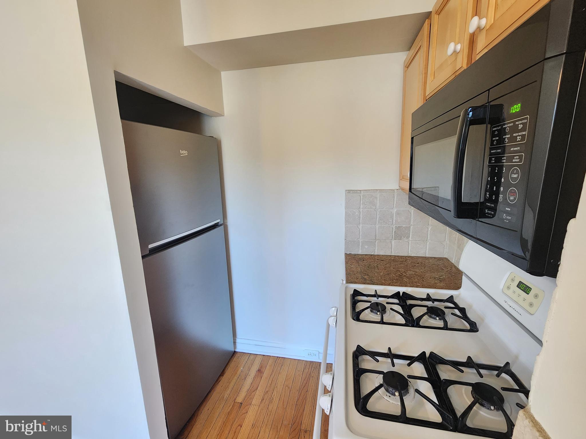 4322 Main Street, Unit 2 Philadelphia, PA 19127 - Photo 18 of 27 a view of a storage and utility room with washer and dryer