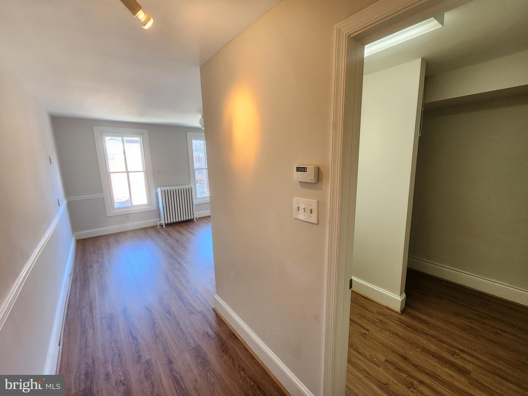 4322 Main Street, Unit 2 Philadelphia, PA 19127 - Photo 24 of 27 an empty room with wooden floor and windows