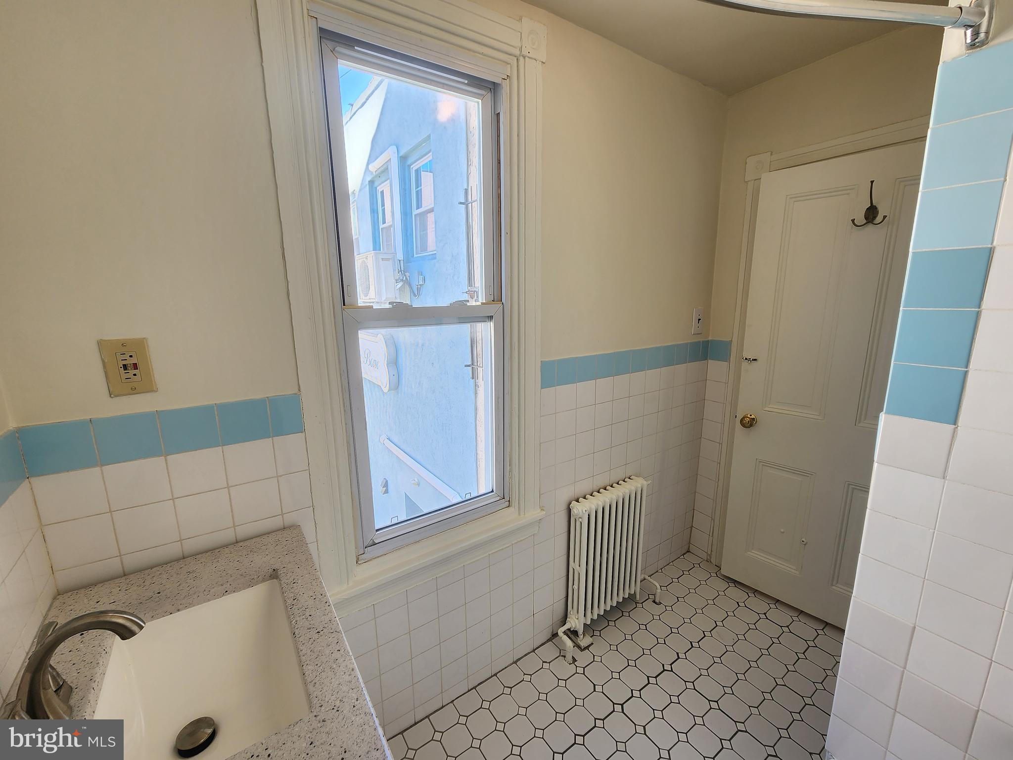 4322 Main Street, Unit 2 Philadelphia, PA 19127 - Photo 10 of 27 a bathroom with a sink and toilet