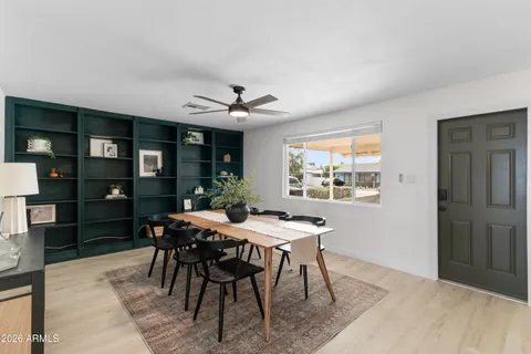 a dining room with furniture and window