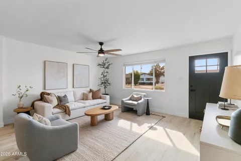 a living room with furniture and a large window
