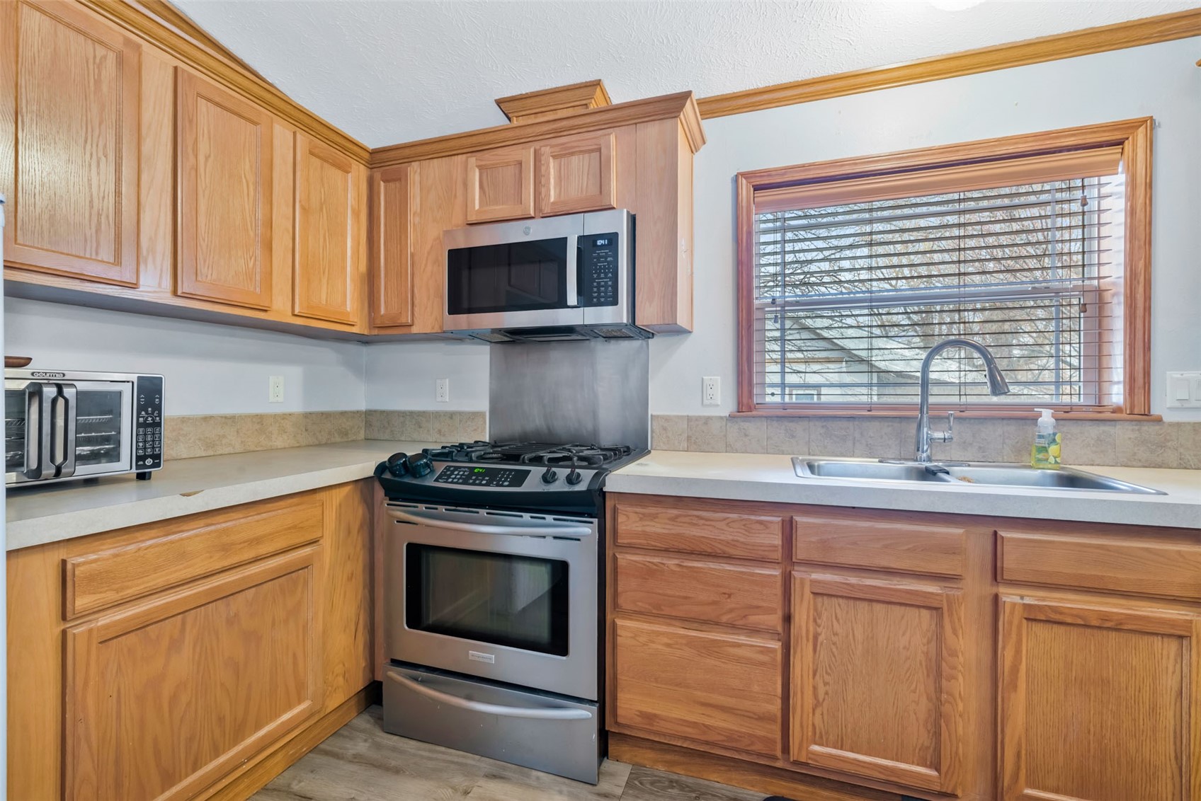 366 South 2nd Street Hayden, CO 81639 - Photo 15 of 38 a kitchen with stainless steel appliances granite countertop a sink stove and microwave
