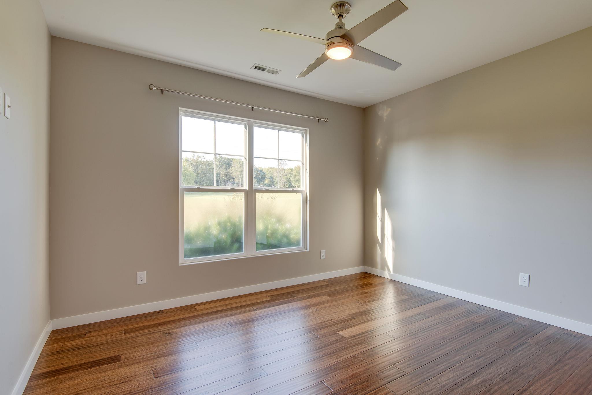 11494 Patterson Road Rockvale, TN 37153 - Photo 16 of 30 Front bedroom down stairs with hardwood floors and an attached jack-n-jill bath
