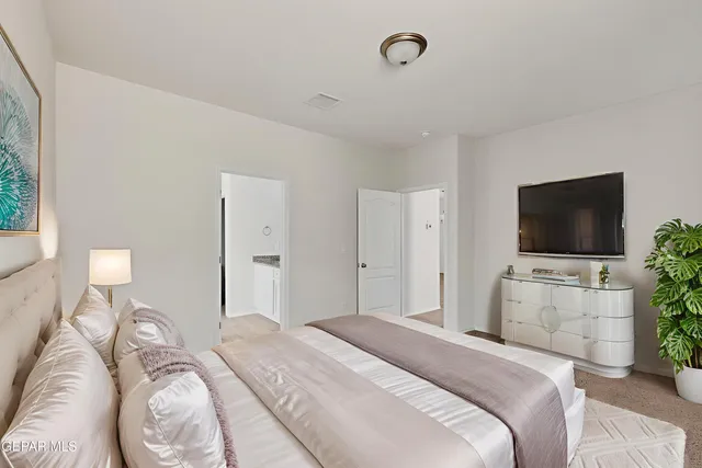 a view of a kitchen with wooden floor and a ceiling fan