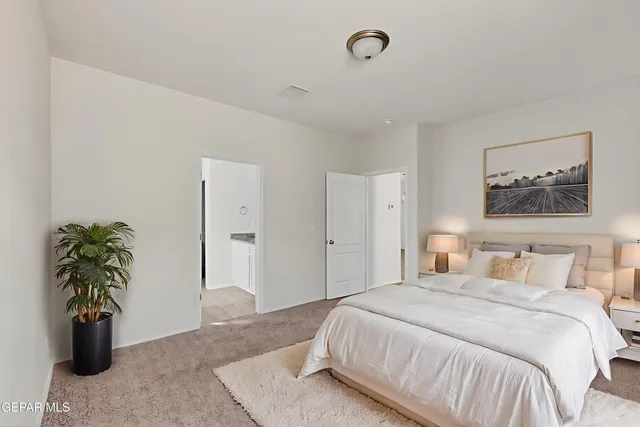 a view of a room with wooden floor and ceiling fan