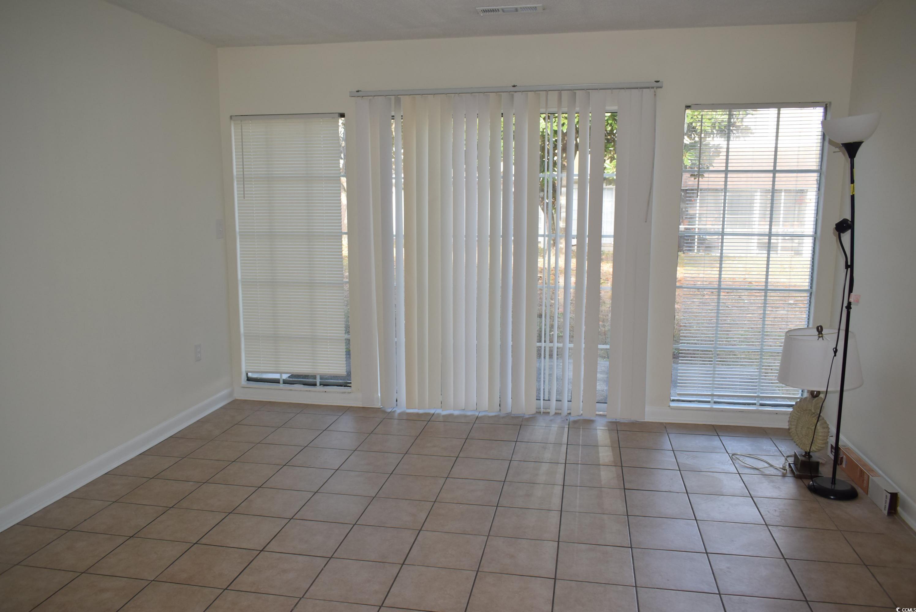 1208 Pinegrove Drive, Unit H Myrtle Beach, SC 29577 - Photo 13 of 18 Tiled empty room featuring baseboards