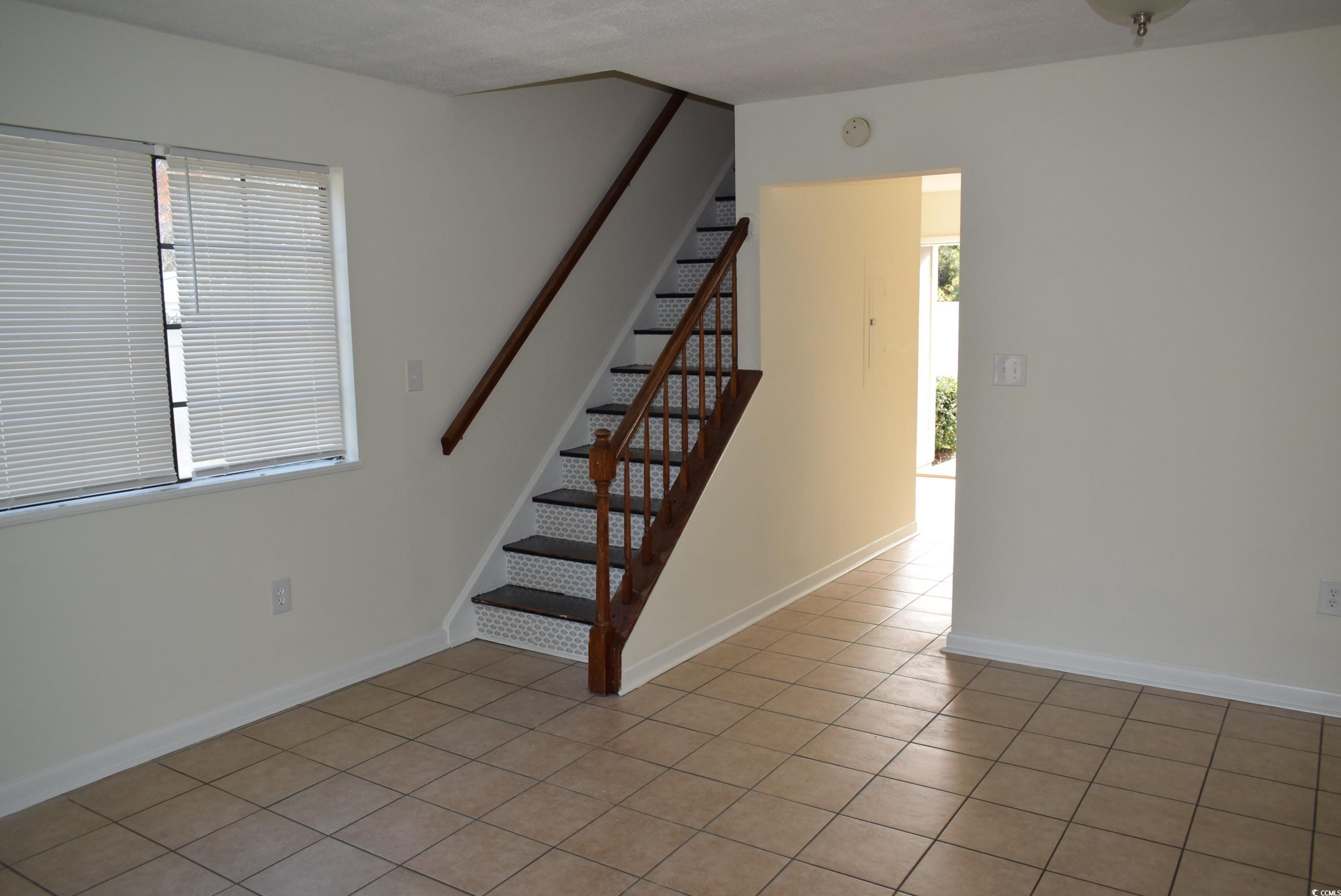 1208 Pinegrove Drive, Unit H Myrtle Beach, SC 29577 - Photo 14 of 18 Staircase featuring baseboards and tile patterned flooring