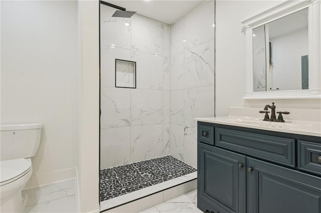 24 McClure Road Temple, GA 30179 - Photo 18 of 41 a bathroom with a sink and a mirror
