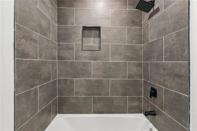 a bathroom with a sink and mirror