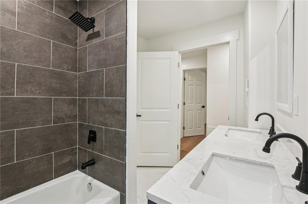24 McClure Road Temple, GA 30179 - Photo 21 of 41 a bathroom with a sink and mirror