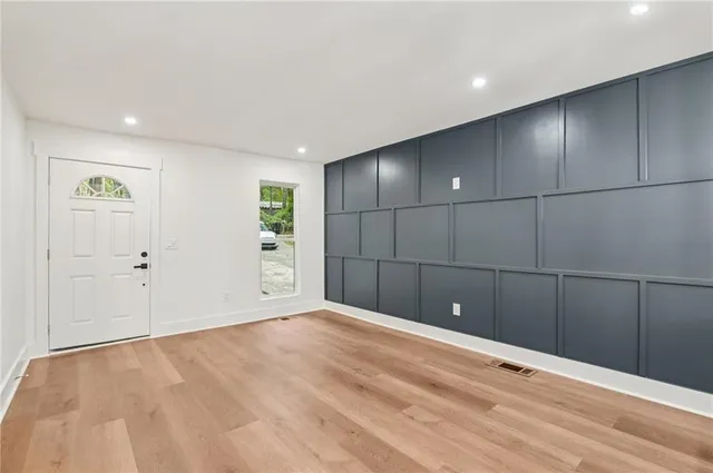 a view of a livingroom with an empty space and window