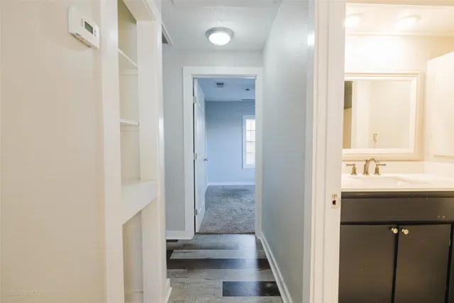 a bathroom with a sink a mirror and a shower