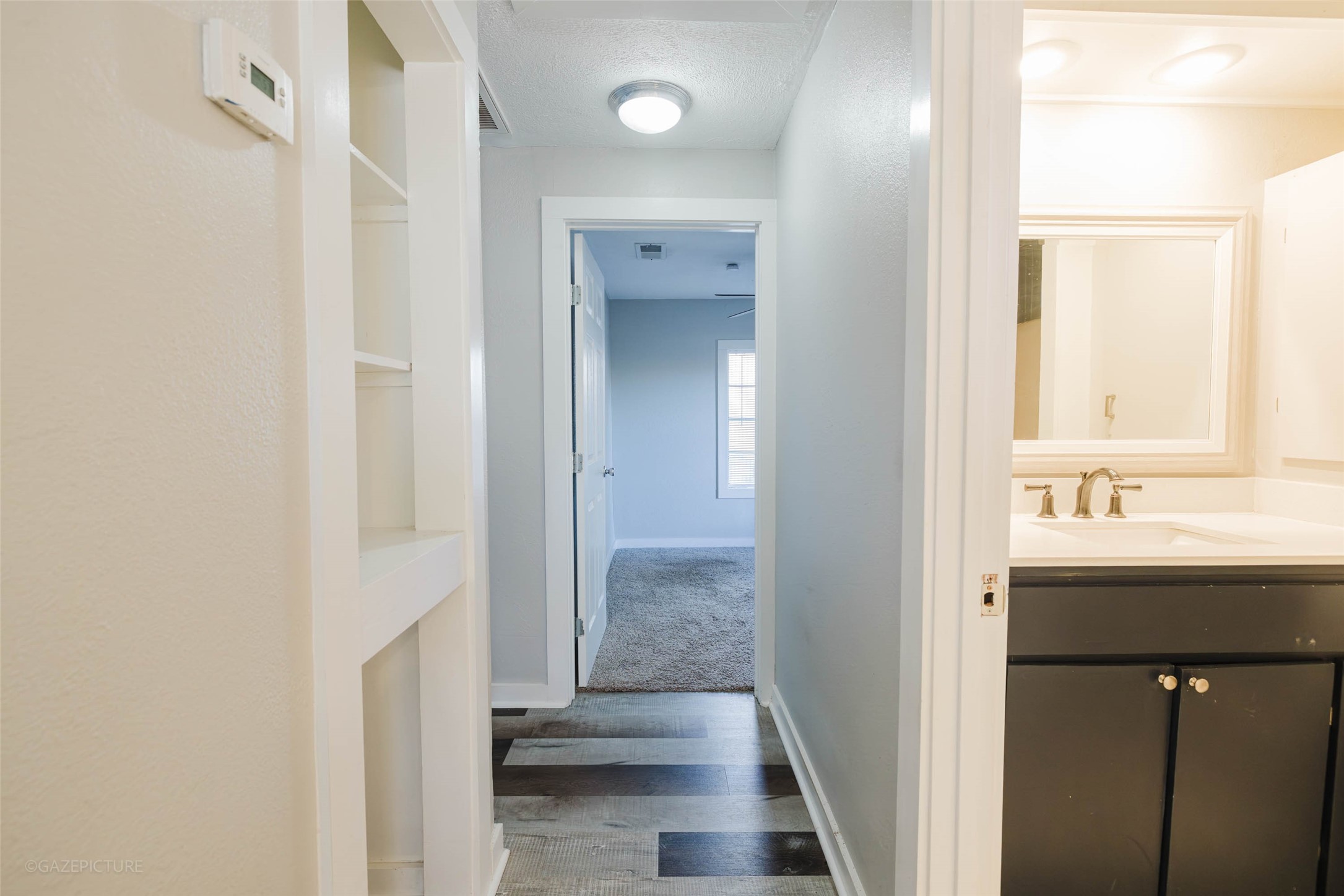 2518 Daugherty Street Waller, TX 77484 - Photo 11 of 32 a bathroom with a sink a mirror and a shower