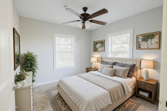 a bedroom with a bed and a window