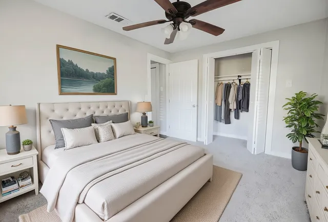 a bedroom with bed and a potted plant