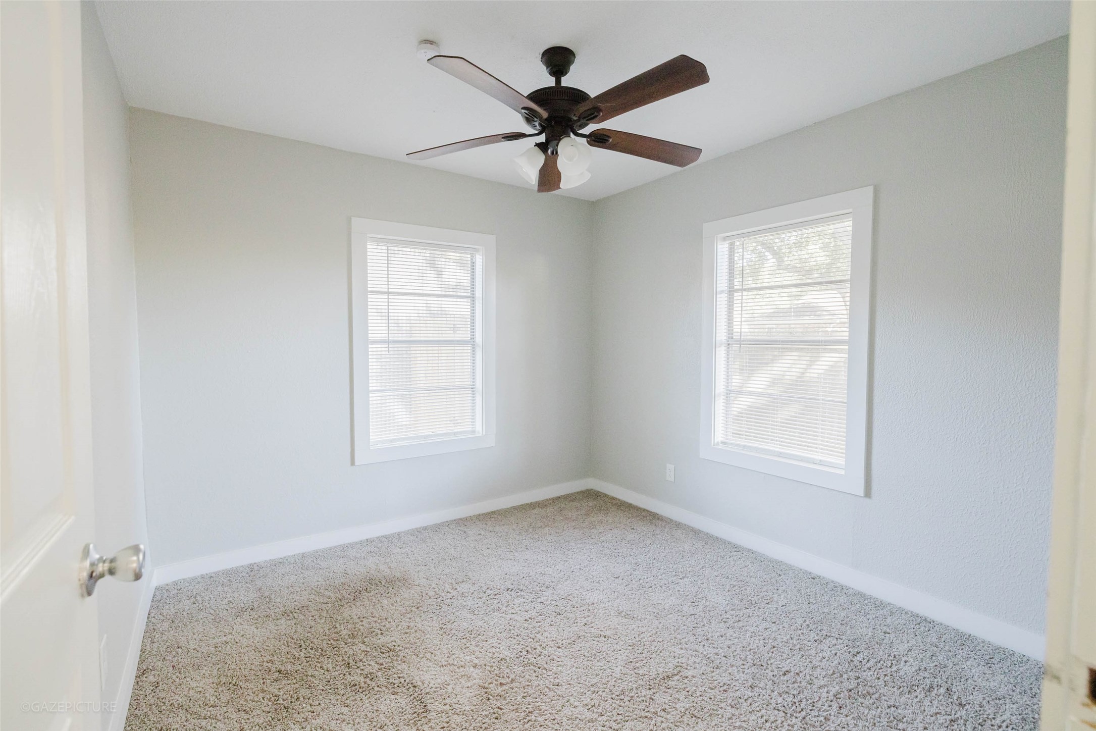 2518 Daugherty Street Waller, TX 77484 - Photo 28 of 32 an empty room with fan and windows