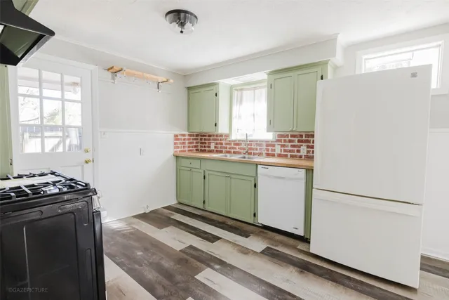 a kitchen with a stove and a refrigerator