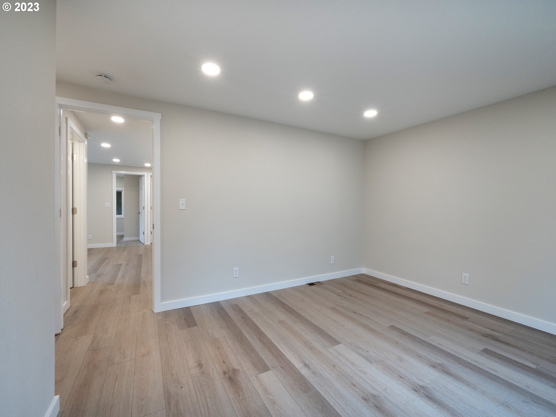 5131 Daisy Street Springfield, OR 97478 - Photo 23 of 45 an empty room with wooden floor and windows