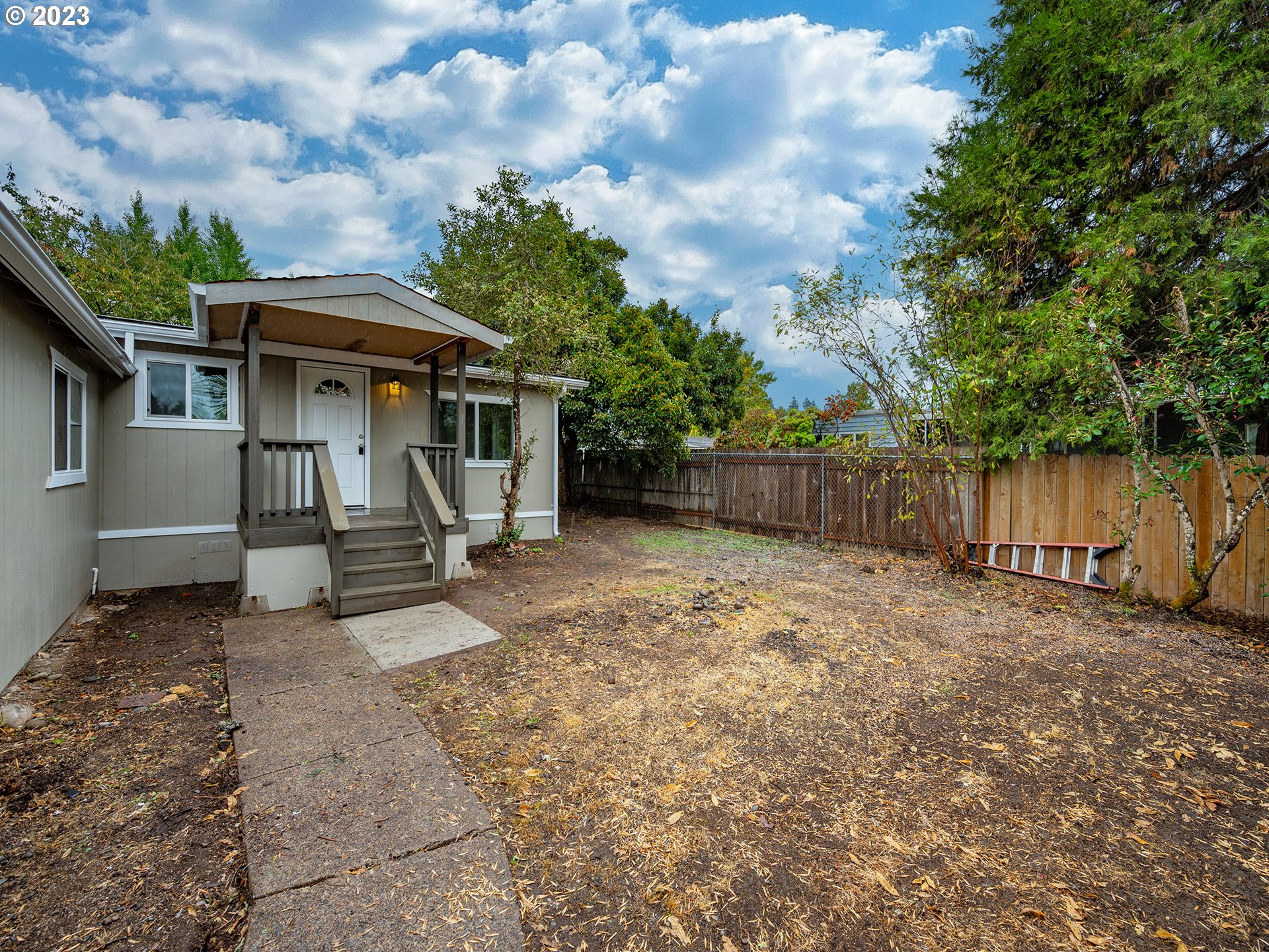 5131 Daisy Street Springfield, OR 97478 - Photo 41 of 45 a view of a house with backyard and a tree