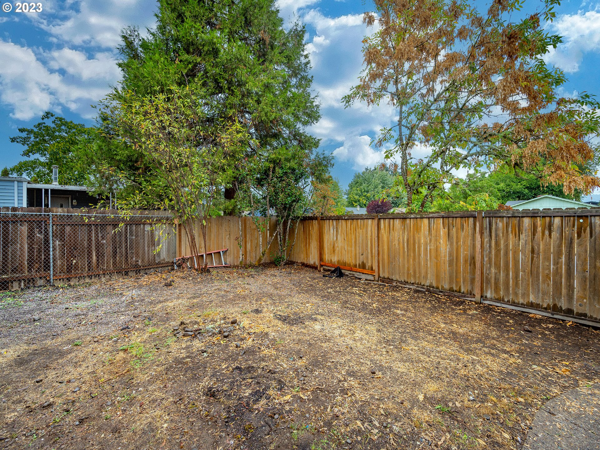 5131 Daisy Street Springfield, OR 97478 - Photo 42 of 45 a view of outdoor space with wooden fence