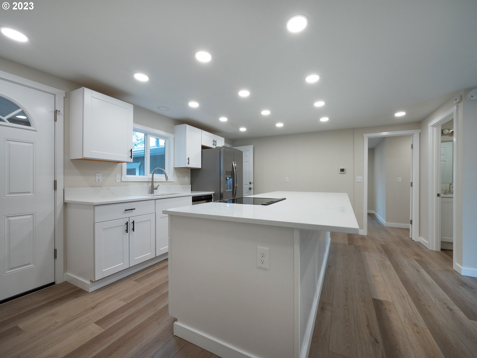 5131 Daisy Street Springfield, OR 97478 - Photo 5 of 45 a kitchen with a sink microwave and cabinets