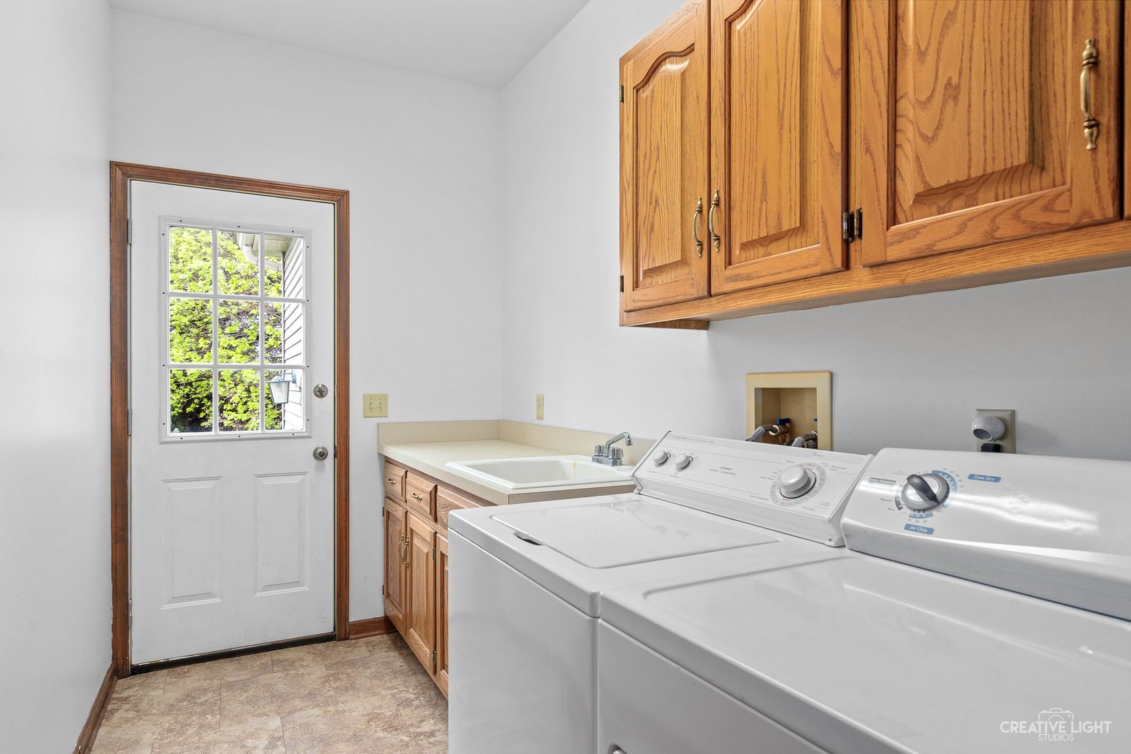 980 Eldamain Road Plano, IL 60545 - Photo 14 of 27 a utility room with dryer and washer