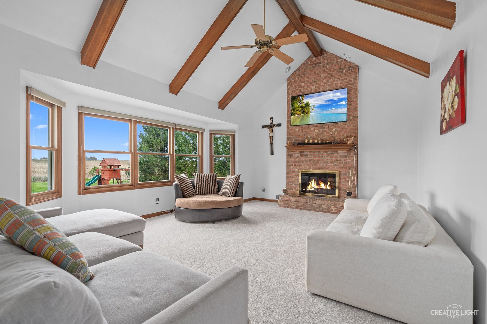 980 Eldamain Road Plano, IL 60545 - Photo 7 of 27 a living room with furniture and a fireplace