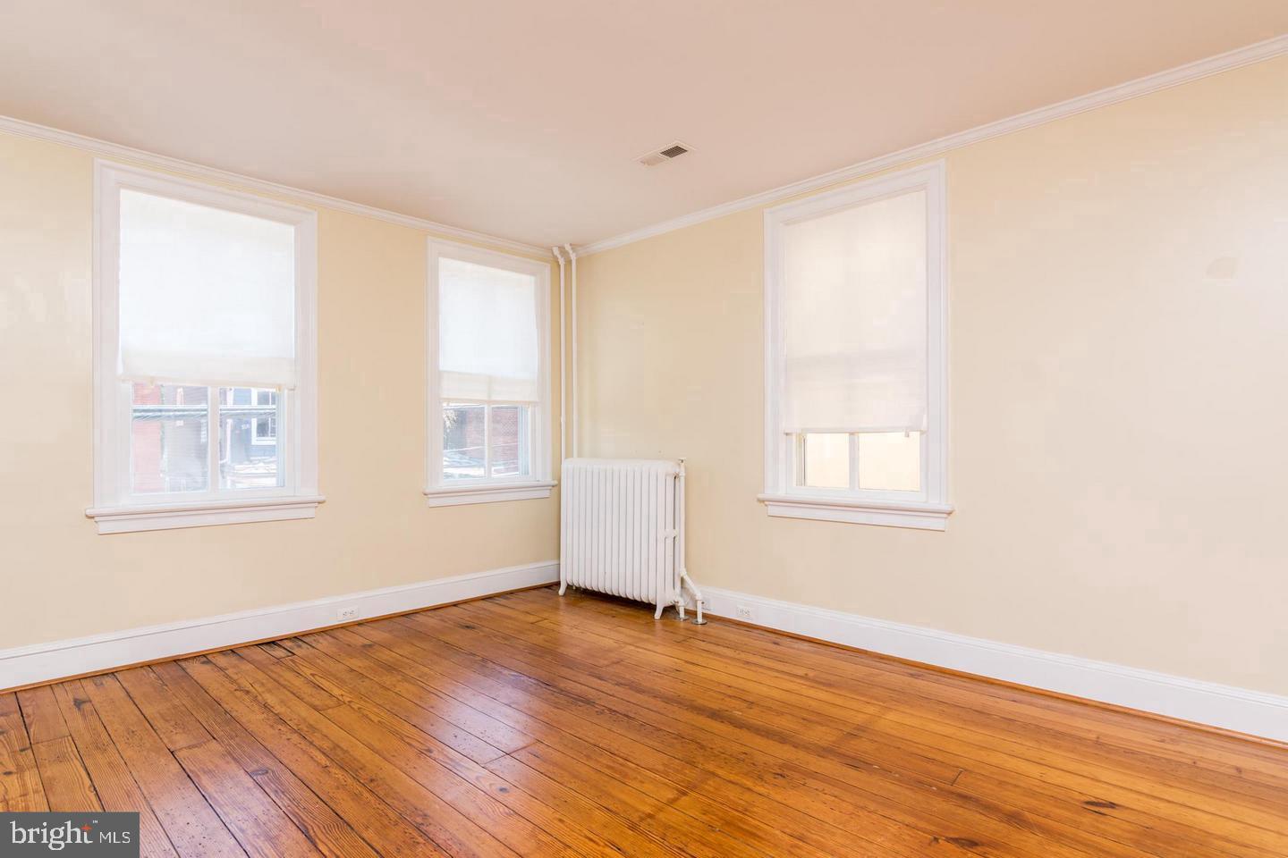 151 Duke Of Gloucester Street Annapolis, MD 21401 - Photo 15 of 28 a view of empty room with wooden floor and fan
