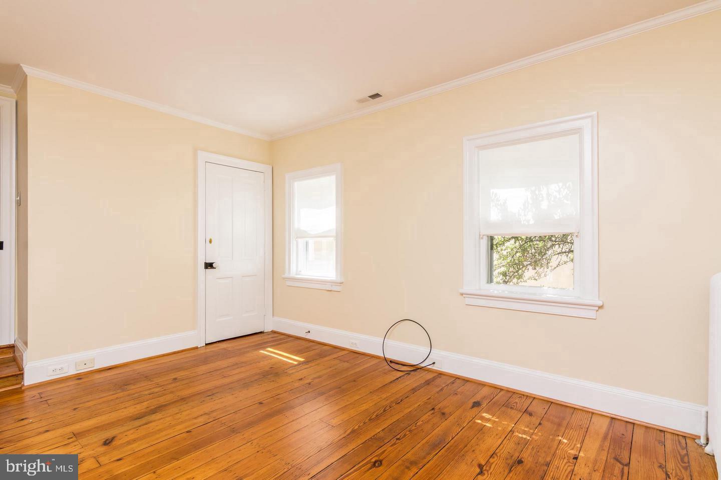 151 Duke Of Gloucester Street Annapolis, MD 21401 - Photo 21 of 28 a view of a room with wooden floor and a window