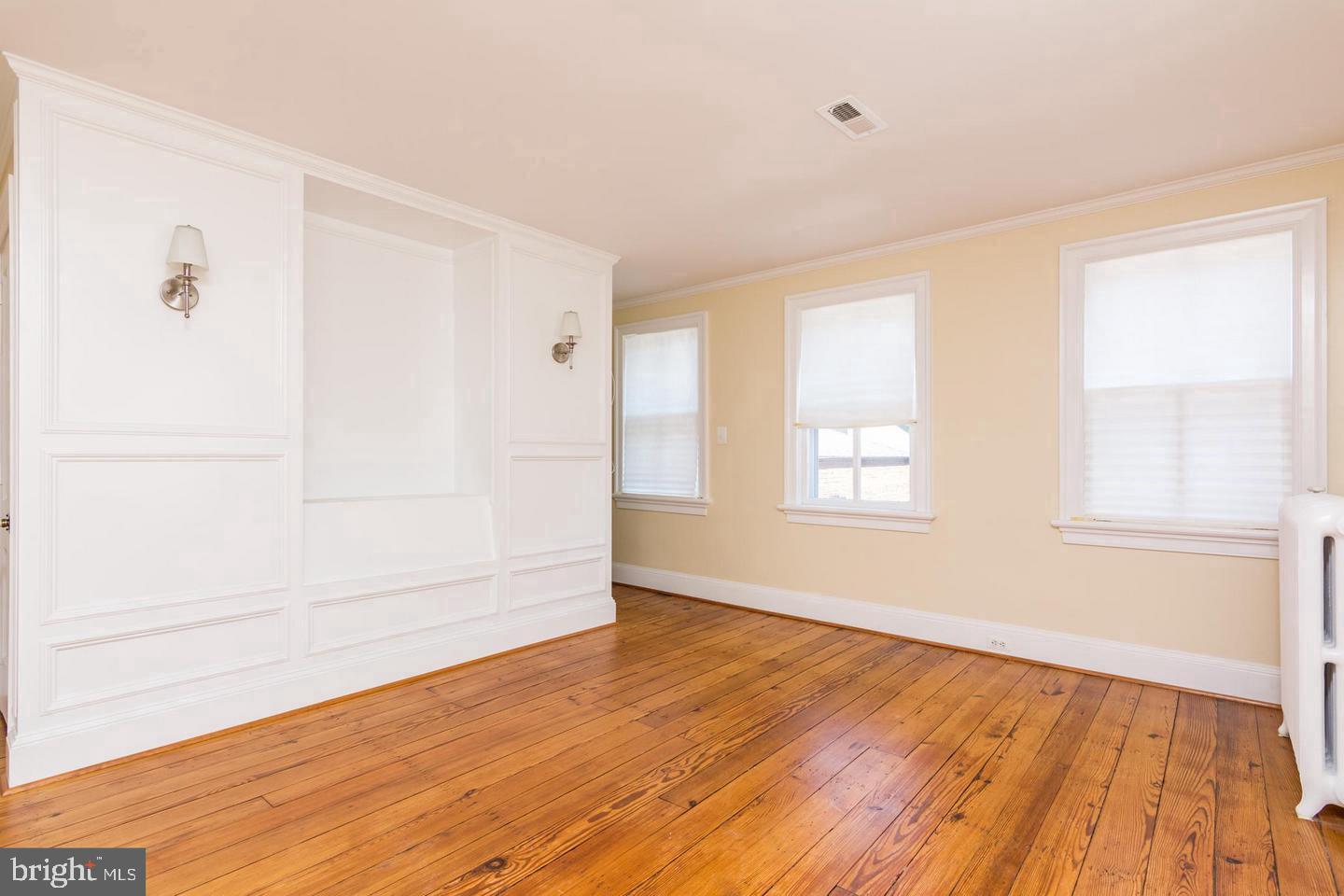 151 Duke Of Gloucester Street Annapolis, MD 21401 - Photo 23 of 28 a view of an empty room with wooden floor and a window