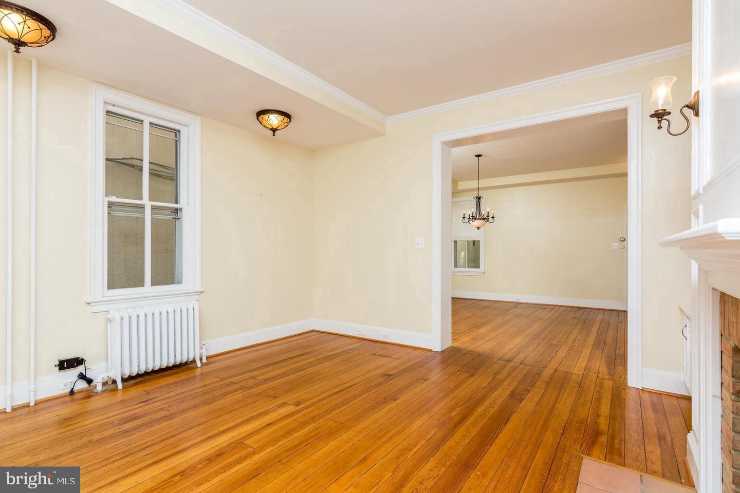 151 Duke Of Gloucester Street Annapolis, MD 21401 - Photo 8 of 28 an empty room with wooden floor and windows