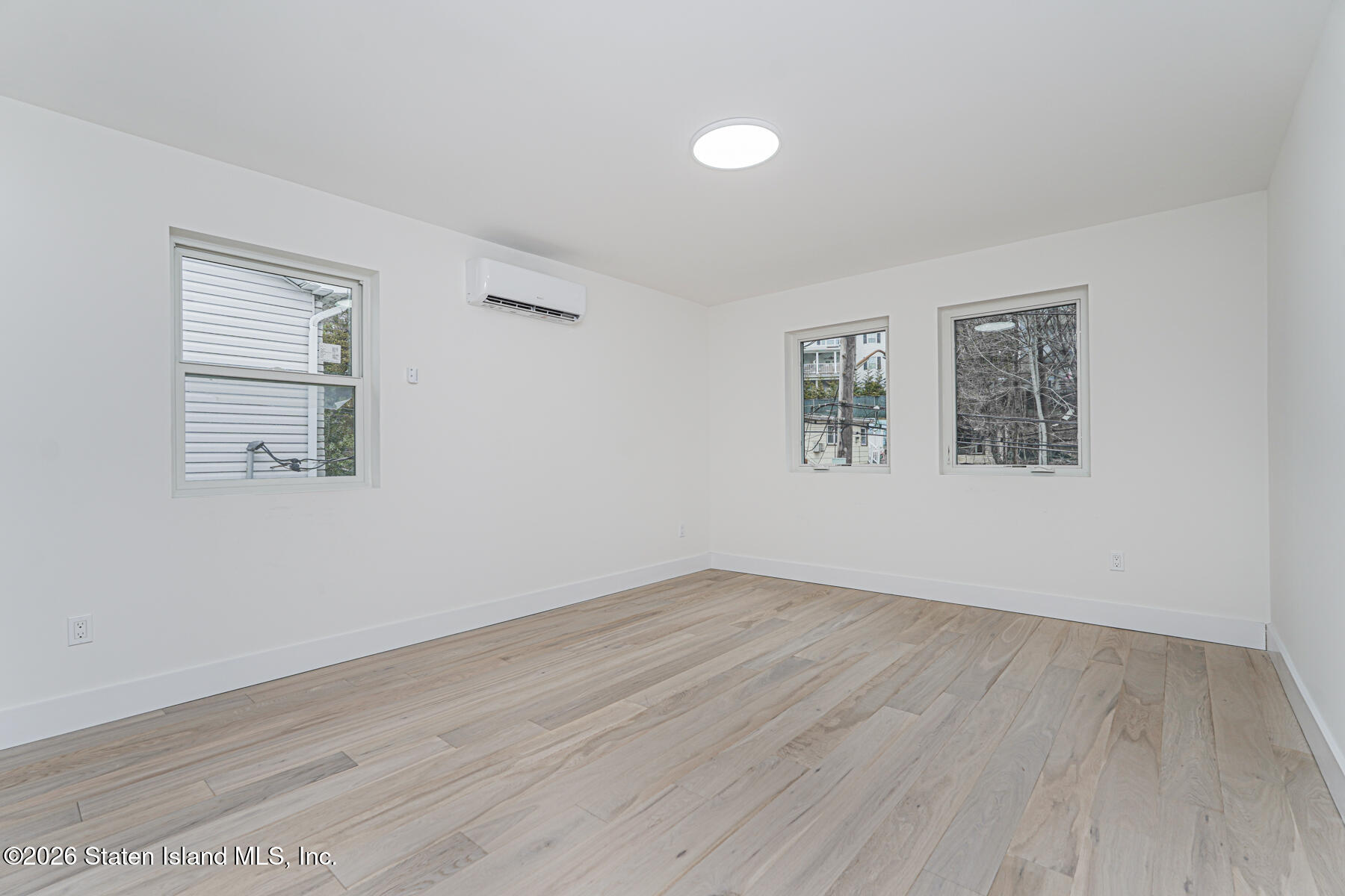 54 Cedarcliff Road Staten Island, NY 10301 - Photo 24 of 49 a view of empty room with wooden floor and fan