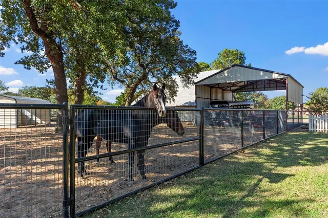 a view of a swimming pool and a yard