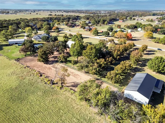 aerial view of a house with a yard