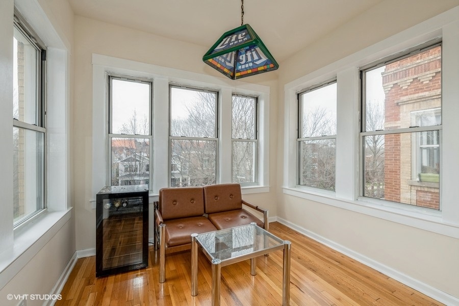 Undisclosed Address Chicago, IL 60641 - Photo 11 of 15 a living room with furniture and a window