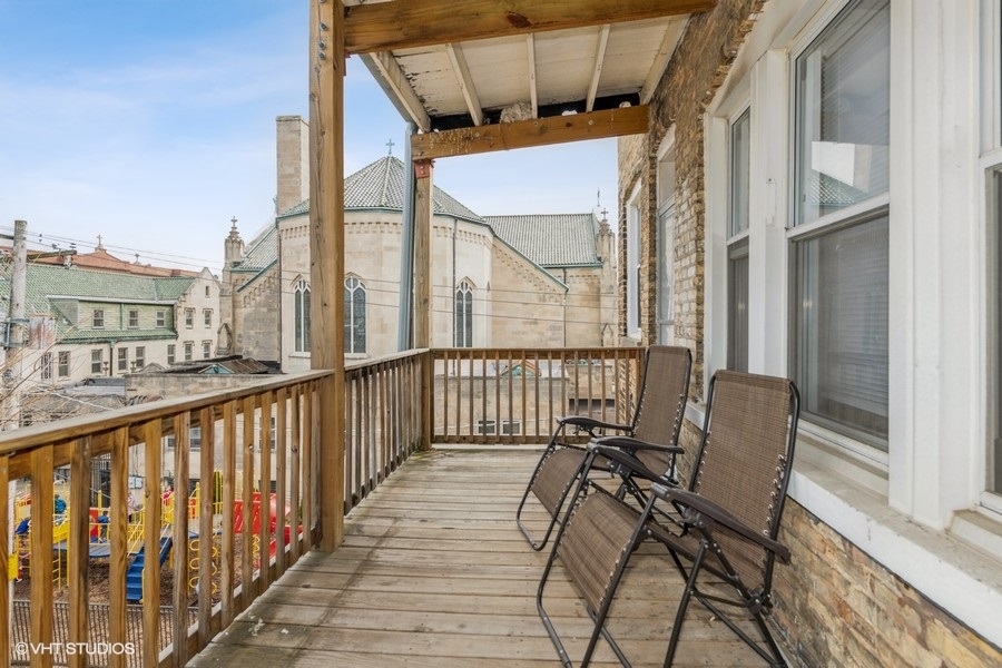Undisclosed Address Chicago, IL 60641 - Photo 13 of 15 a view of a balcony with furniture