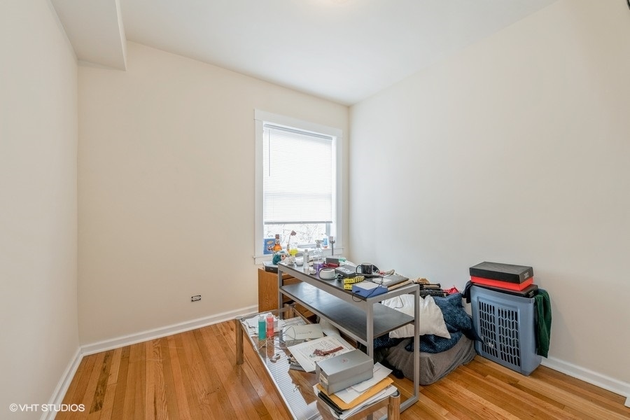 Undisclosed Address Chicago, IL 60641 - Photo 8 of 15 a living room with furniture and a wooden floor