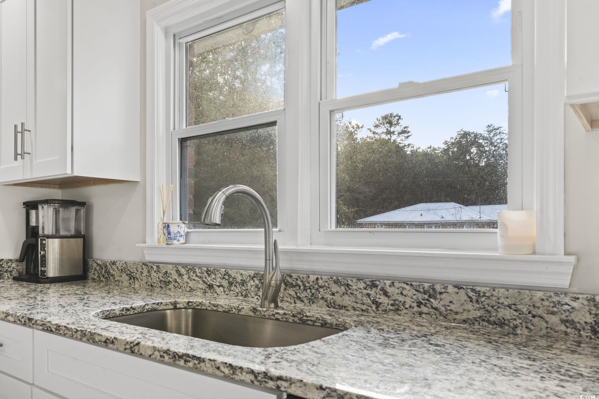 1673 Middleton Street Georgetown, SC 29440 - Photo 16 of 40 Details with light stone counters, sink, and white