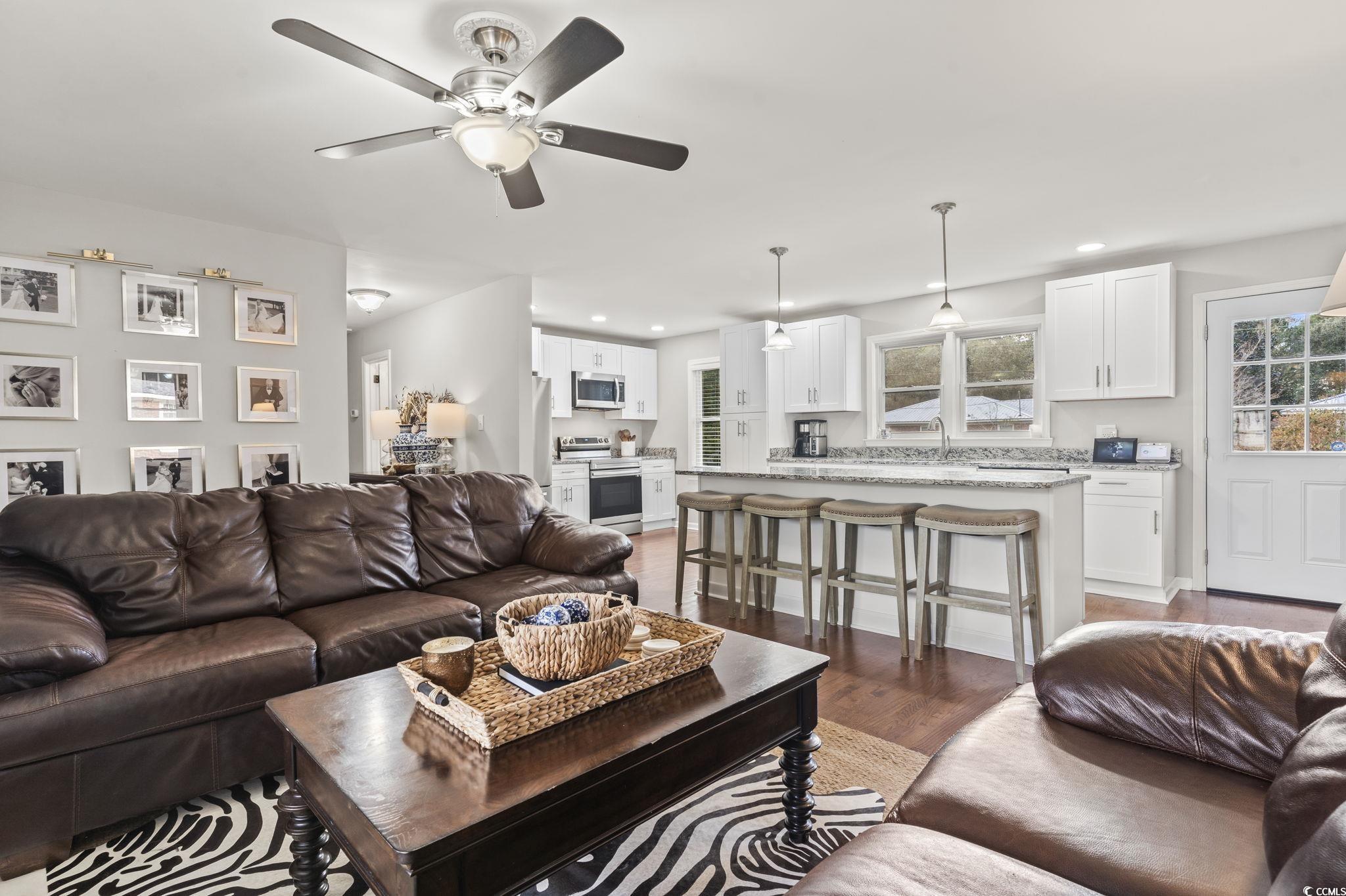 1673 Middleton Street Georgetown, SC 29440 - Photo 18 of 40 Living room with ceiling fan, sink, and dark wood-