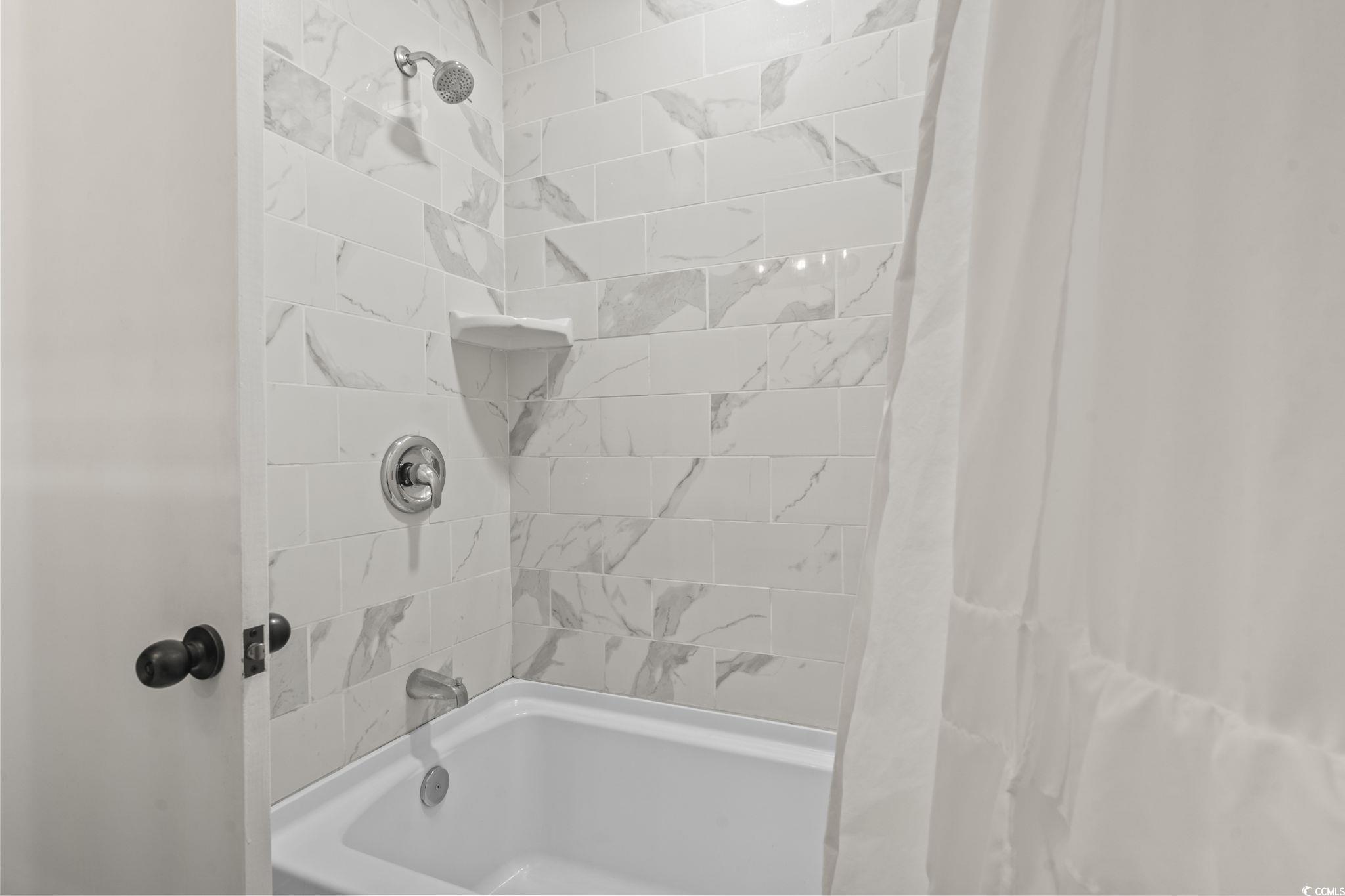 1673 Middleton Street Georgetown, SC 29440 - Photo 27 of 40 Bathroom featuring shower / tub combo with curtain