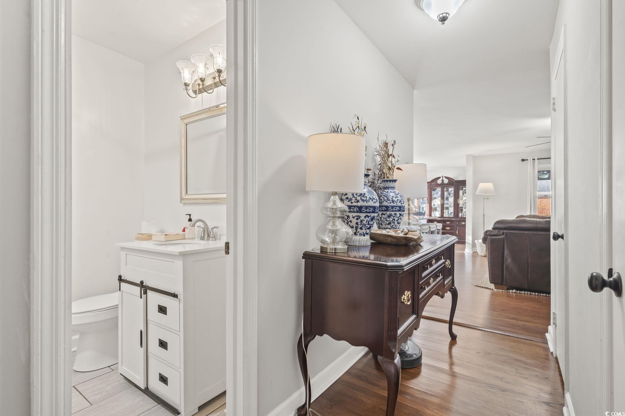 Hall featuring sink and light hardwood / wood-styl