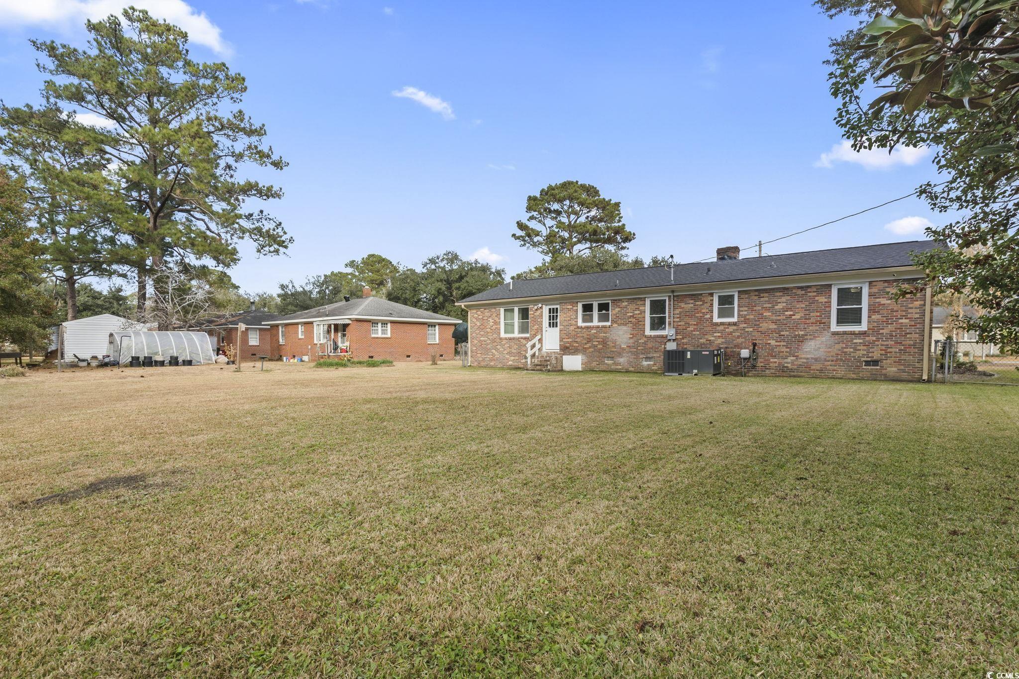 1673 Middleton Street Georgetown, SC 29440 - Photo 31 of 40 Back of house featuring a lawn