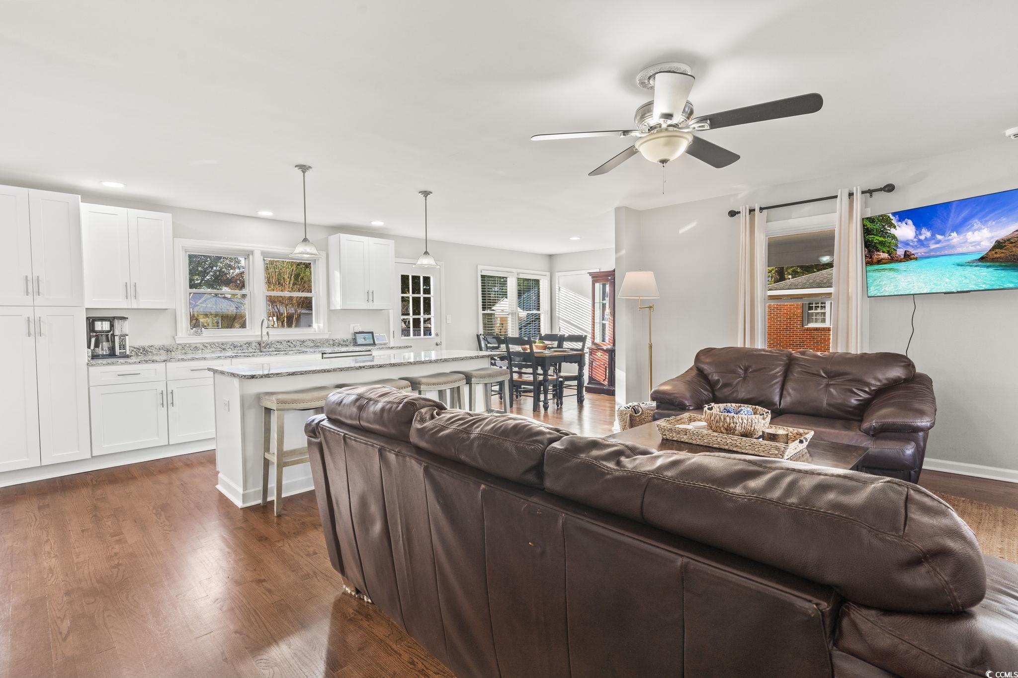 Living room with dark hardwood / wood-style floors